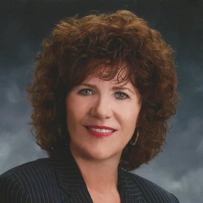 Studio portrait of a person with curly hair